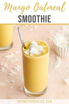 mango oatmeal smoothie in a glass with a spoon on the side