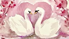 two white swans with their necks wrapped around each other in front of some pink flowers