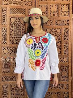 This Beautiful Hand embroidered blouse has a unique and Mexican inspired Floral design. Note: This blouse comes in one size which fits sizes Small and Medium. Jewelry modeled may be purchased separately. Mexican Blouses, Multicolor Blouse, Hand Embroidered Blouse, Mexican Blouse, 5 De Mayo, Multi Color Blouse, Beautiful Belts, Mexican Dresses, Cotton Gifts