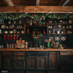 the kitchen is decorated for christmas with stockings and stocking hanging from the wall above it