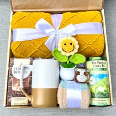 a gift box with coffee, tea and other items for someone's special occasion