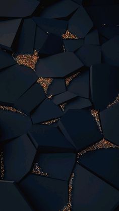 an abstract black and gold background with lots of sparkles in the dark, like hexagonal shapes