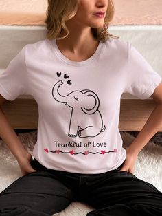 Trunkful of Love Tshirt, Elephant Lover Shirt, Cute Elephant Shirt, Elephant Shirt This classic unisex jersey short sleeve tee fits like a well-loved favorite. Soft cotton and quality print make users fall in love with it over and over again. These t-shirts have-ribbed knit collars to bolster shaping. The shoulders are tapered for a better fit over time. Dual side seams hold the garment's shape for longer.  Made with 100% Airlume combed and ring-spun cotton, a lightweight fabric that is easy to Valentine's Day Graphic Print Short Sleeve T-shirt, Valentine's Day Casual T-shirt With Graphic Print, Valentine's Day Casual Graphic Print T-shirt, Casual Tops With Valentine's Day Graphic Print, Casual Valentine's Day T-shirt With Graphic Print, Casual Valentine's Day Graphic T-shirt, Casual Tops With Graphic Print For Valentine's Day, Casual Valentine's Day Graphic Print Tops, Casual Cotton T-shirt For Valentine's Day