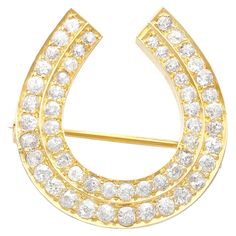 A stunning, fine and impressive antique 2.36 carat diamond and 9 karat yellow gold horseshoe brooch; part of our diverse antique jewelry and estate jewelry collections. This exceptional, fine and impressive antique brooch has been crafted in 9k yellow gold. This stunning diamond brooch has been modelled in the form of a horseshoe. The impressive yellow gold horseshoe shaped setting is embellished with two paralleling bands comprised of fifty-four Old European round cut diamonds, totalling 2.36ct Antique Gemstone Rings, Unique Brooch, Antique Brooches, Diamond Brooch, Antique Engagement Rings, Antique Diamond, Antique Jewellery, Round Cut Diamond, Estate Jewelry