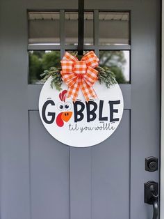 a door with a sign that says gobble it's your world