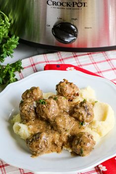 a white plate topped with meatballs and mashed potatoes next to an instant pot