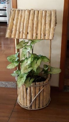 a potted plant sitting on top of a wooden stand