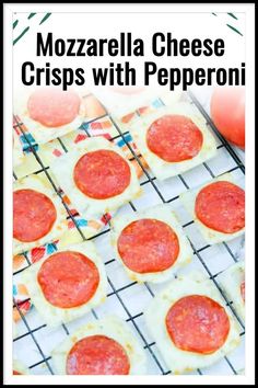 small pizzas with cheese and pepperoni sitting on a cooling rack next to tomatoes