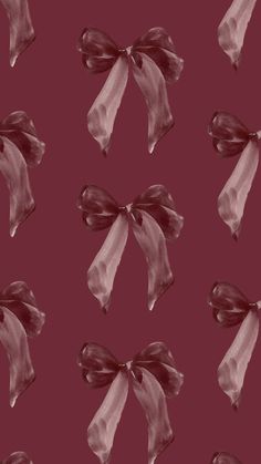 an image of a bow pattern on a maroon background that looks like it has been painted with acrylic paint