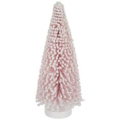 a pink christmas tree is shown on a white base