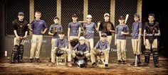 a group of baseball players are posing for a team photo in front of a fence