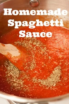 homemade spaghetti sauce in a pot with a wooden spoon