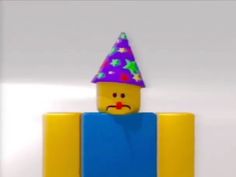 a lego man with a party hat on