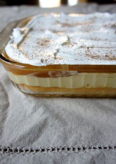 a casserole dish is covered in powdered sugar and sits on a table