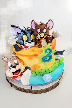 a birthday cake with cartoon characters on it