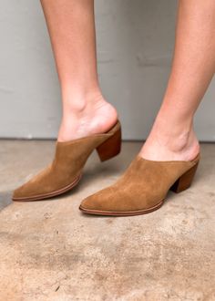 Hop on the TREND TRAIN with these super cute Pointed Toe Suede Mules. The color is chef's kiss for fall. Comfortable enough for all day wear, these new mules from Matisse will become your go to this season. The heel is not too high and the style is perfect. If you live in the south, this will be a good shoe for most of the winter. Suede upper Manmade outsole 2.5 in/6.35 cm heel Textile lining Padded insole Leather stacked heel Imported Trendy Brown Slip-on Mules, Workwear Mules With 4-inch Block Heel, Chic Spring Clogs With 4-inch Heel, Trendy Spring Closed Toe Mules, Chic Clogs With 4-inch Block Heel, Trendy Mules With Reinforced Heel, Spring Slip-on Pointed Toe Clogs, Slip-on Pointed Toe Clogs For Spring, Brown Pointed Toe Mules With 4-inch Heel