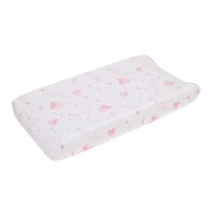 a pink and white baby changing pad with stars, clouds and hearts on the cover