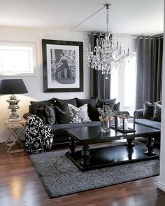 a living room filled with furniture and a chandelier