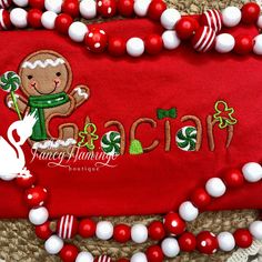 This sweet and festive personalized gingerbread applique embroidered shirt is the perfect addition to your holiday wardrobe! Adorned with a delightful gingerbread design that is meticulously hand-appliqued and embroidered, this shirt is sure to spread cheer wherever you go. Customized with your chosen name or initial, it makes a truly special and unique gift for yourself or a loved one. Made with high-quality materials, this shirt is not only charming but also durable, making it ideal for all your holiday gatherings and celebrations. Get into the spirit of the season with this merry and one-of-a-kind shirt! Please specify shirt color in personalization. Fonts and thread colors can be found here:  https://fancyflamingoboutiqu.etsy.com/listing/1260866731/font-options-thread-color-options-do- Gingerbread Applique, Gingerbread Dress, Gingerbread Shirt, Gingerbread Design, Fancy Flamingo, Jingle All The Way, Holiday Wardrobe, Kids Boutique, Christmas Embroidery