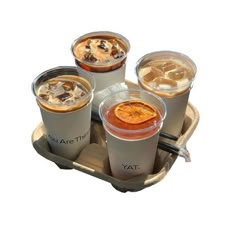 three cups of iced coffee on a tray