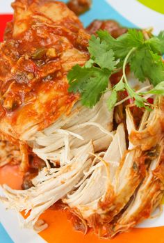 a close up of food on a plate with garnishes and cilantro