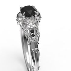 "To see my collection of Skull themed rings, click here: https://www.etsy.com/shop/MetalWendler?ref=seller-platform-mcnav&search_query=skull Beautifully crafted Art Nouveau style filigree skull engagement ring. Actual ring may vary slightly as they are finished by hand, but final rings are very, very close to what you see in the images. See my reviews for customer reactions to rings. This ring features a ~4.8mm round Black Diamond center stone. Message us about a custom idea! Free Shipping w Elegant Skull Ring As Gift, Elegant Skull Ring For Anniversary, Gothic Anniversary Ring With Intricate Design, Elegant White Gold Skull Ring For Anniversary, Elegant Sterling Silver Skull Ring, Elegant Skull Ring Gift, Elegant White Gold Skull Ring For Promise, Elegant White Gold Skull Ring, Elegant White Gold Skull Promise Ring