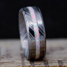 a wedding band with an opal inlay