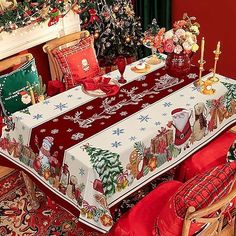 a dining room table covered in christmas decorations