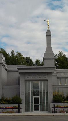 a large building with a statue on top of it