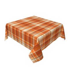 an orange and white plaid tablecloth on a white background