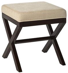 a wooden stool with a tan seat cushion on it's backrest and legs