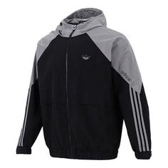 Men's adidas originals Contrasting Colors Raglan Sleeve Woven Hooded Jacket Black HC0328 Techwear Cotton Hooded Jacket For Sports, Cotton Techwear Hooded Jacket For Sports, Sporty Nylon Hooded Jacket With Ribbed Cuffs, Hooded Nylon Track Jacket With Ribbed Cuffs, Winter Nylon Track Jacket With Three Stripes, Cotton Techwear Outerwear For Sports, Adidas Long Sleeve Nylon Track Jacket, Adidas Nylon Long Sleeve Track Jacket, Adidas Cotton Track Jacket In Casual Style