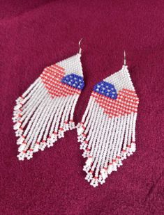 Patriotic earrings long beaded earrings, handmade earrings. america flag earrings, independence day earrings Measurements: Length - 4.72 inches (12 cm) (including ear wires). Width - 1.57 inches (4 cm) Materials: Colour hooks silver Czech beads and strong synthetic thread.  Handmade earrings from high-quality Czech beads. Patriotic earrings can  until Israel's Independence Day. It can also make a great gift.   100% handmade. Shipping worldwide Please note that due to lighting effects, monitor's brightness, contrast and other settings, there might be some slight differences in the color tone/shade of the web site's photo and the actual item. Flag Earrings, Long Beaded Earrings, Patriotic Earrings, America Flag, Earrings Long, Color Tone, Czech Beads, Long Earrings, Colour Tone