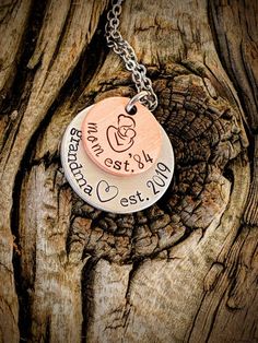 Personalized hand stamped grandma necklace. Gift for grandma. Custom mothers day gift for grandma. Nana necklace. Memaw gift. First time grandma gift. Pregnancy announcment to mom. Custom pregnant announcement.Hand stamped and made to order. Made from a 5/8" copper disc, stamped with a mama and baby stamp and stamped with the phrase, "Mom est. (year of your choice)," then a 7/8" aluminum disc, stamped with the phrase, "grandma est. (year of your choice)." Stacked together and attached to a stain Birthday Jewelry For Mother's Day, Meaningful Hand Stamped Jewelry For Mother's Day, Meaningful Hand Stamped Jewelry For Mom, Hand Stamped Jewelry For Birthday And Mother's Day, Hand Stamped Jewelry For Anniversary Gift On Mother's Day, Hand Stamped Necklaces For Anniversary On Mother's Day, Meaningful Hand Stamped Necklace For Mom, Hand Stamped Jewelry For Anniversary And Mother's Day, Hand Stamped Jewelry Gift For Mom