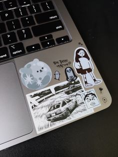 an open laptop computer sitting on top of a table next to a mouse and keyboard