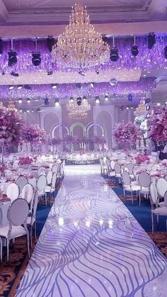 an elaborately decorated banquet hall with chandeliers and tables set up for a formal function