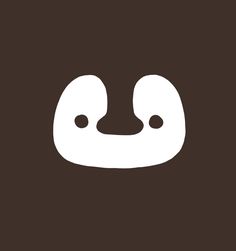 a brown and white logo with the words,'happy face'on it in front of a dark background