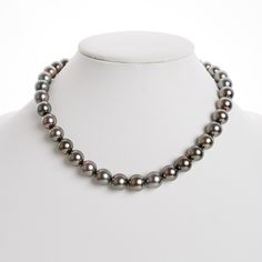 This one-of-a-kind necklace is composed of gorgeous round Tahitian pearls measuring 10.0-12.5 mm in size and is approximately 18 inches in length. The pearls feature a medium silver body color with peacock overtones. Your Tahitian strand will arrive double knotted on color-matching silk. The knotting protects your pearls from rubbing against each other, and if your necklace ever breaks, you won't lose a single pearl. The necklace is finished with a solid, 14 karat clasp with a safety catch for a Silver Bodies, Single Pearl, Tahitian Pearls, Body Color, Gold Polish, Body Colour, Color Matching, Pearl Necklace, Yellow Gold