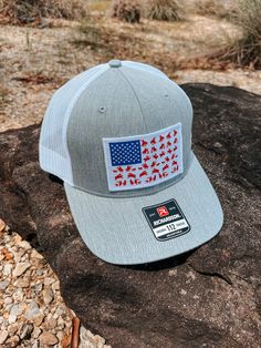 Cactus Alley - Rodeo Flag Cap - Grey / White Rodeo Flag Grey / White Mesh Snapback Cap Gw112 Rodeo Flg White Patriotic Hat With Curved Bill, Patriotic White Hat With Curved Bill, Fitted Outdoor Hat With Curved Bill, Adjustable Patriotic Hat With Flat Bill, Patriotic Snapback Hat With Flat Bill For Outdoor, Patriotic Flat Bill Snapback Hat For Outdoor, Snapback Hat, One Size, Made In Usa, Outdoor Cap Made In Usa, Snapback Hat One Size Fits Most Made In Usa