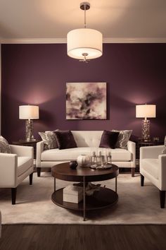 a living room with purple walls and white couches, coffee table and lamps in the corner