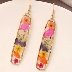 Brand New Boutique Earrings Material: 14k Plated Style Tags: Flowers, Floral, Stunning, Unique, Gift Pressed Flower Resin, Pressed Flower Earrings, Vintage Eyeglasses Frames, Versace Bright Crystal, Rose Colored Glasses, Flower Resin, Silver Caps, Knitted Flowers, Turquoise Leather