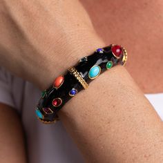 Product Description: Bright gems shine against a black enamel back drop on this statement hinged bangle. Pair with our Gemstone Clip Earrings.  ﻿Style Number: 4606BB Gemstone Bangle, Enamel Bangle, Stone Bangle, Back Drop, Colored Gems, Black Bracelets, Hinged Bangle, Gold Enamel, Kenneth Jay Lane