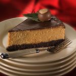 a piece of cake sitting on top of a white plate next to a knife and fork