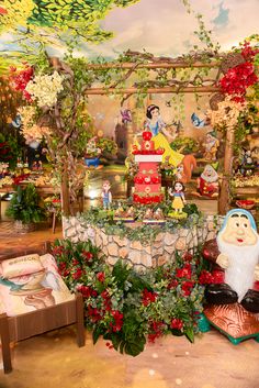 an elaborately decorated birthday party with snowman, santa clause and other holiday decorations