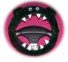 a car steering wheel cover with an animal's head and teeth on the front