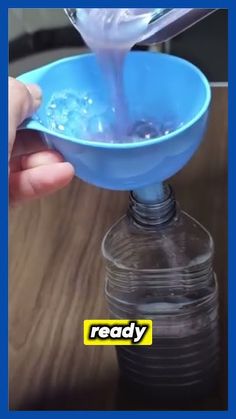 a person pouring water into a blue bowl