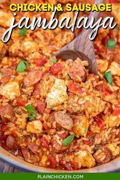 chicken and sausage jambaya in a pan with a wooden spoon on the side