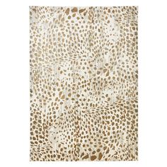 an animal print rug with brown and white spots on the top, in front of a white background