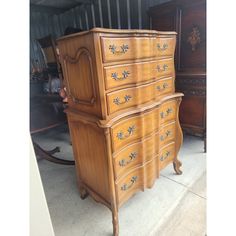 an old dresser is sitting outside on the sidewalk