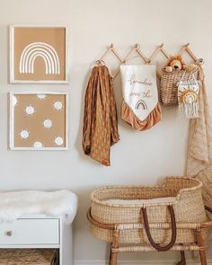 a baby's crib and some pictures on the wall